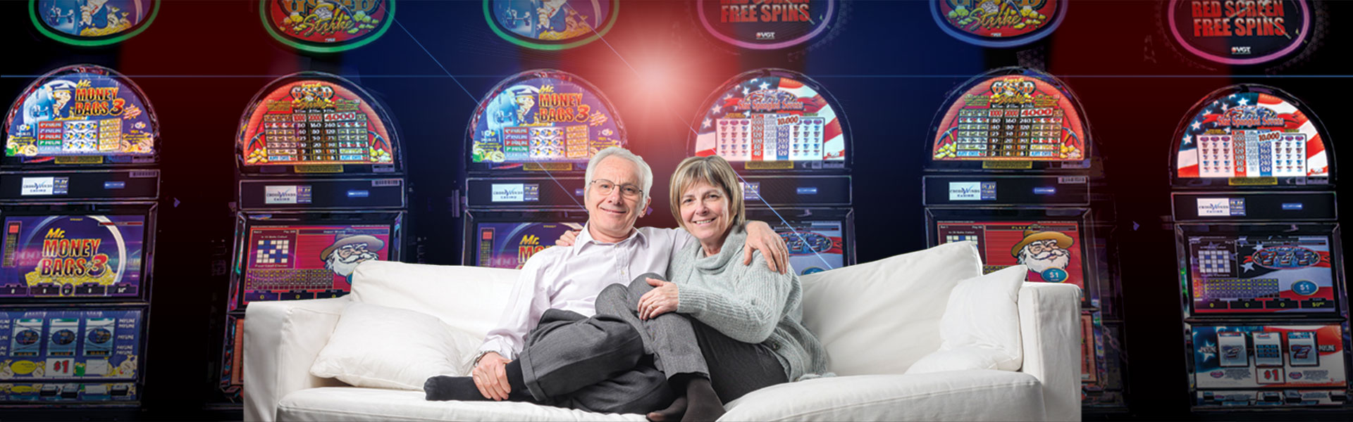 Couple on couch in front of slot machines